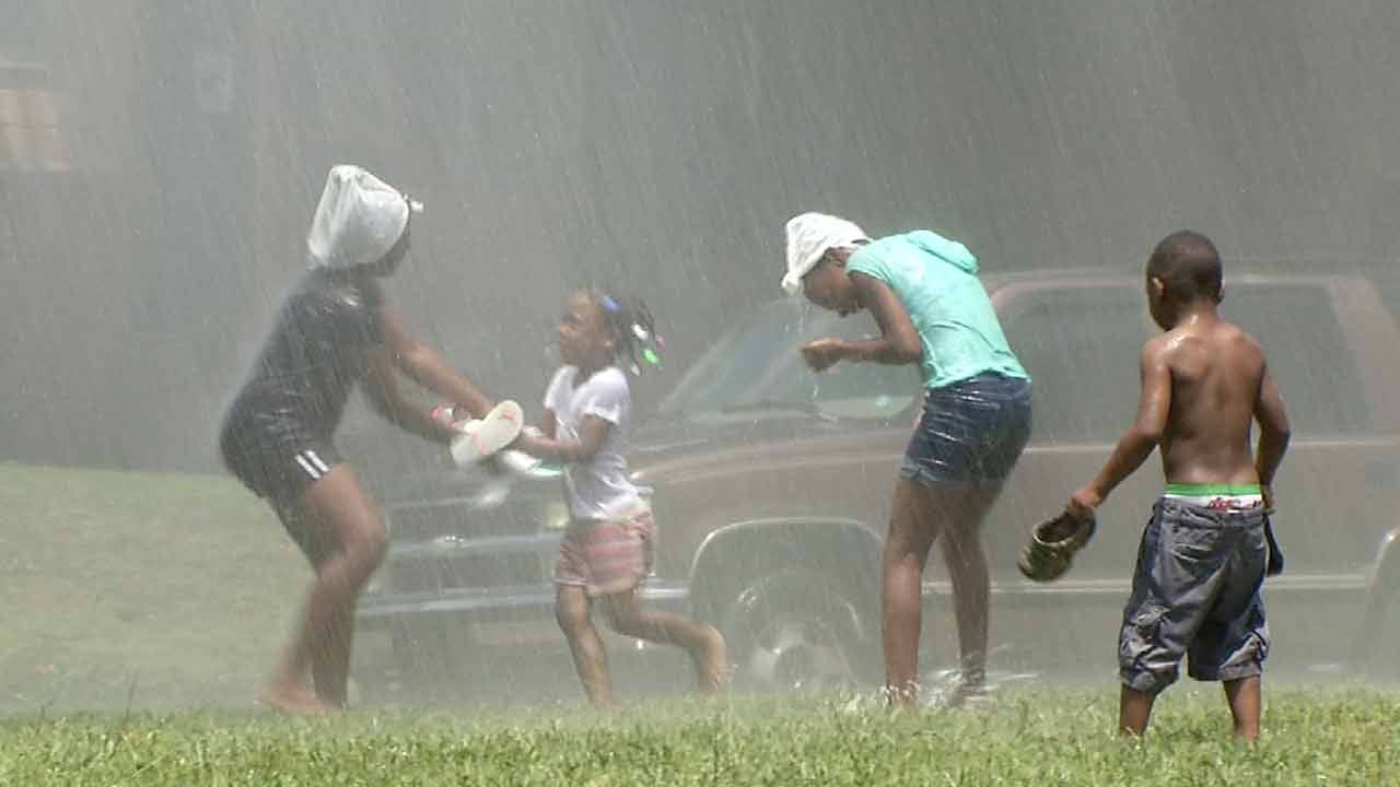 Kids Enjoy Tulsa Water Line Break