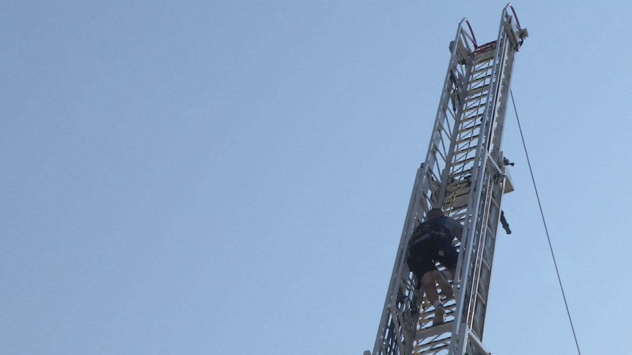 Tulsa Fire Cadets Test Skills By Climbing 85 Foot Ladder