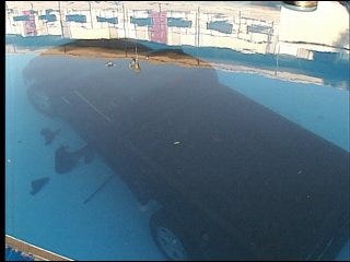 Truck crashes into swimming pool