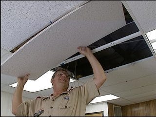 Scouts help repair vandalized school