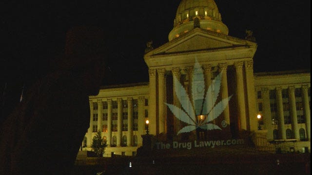 Picture Of Marijuana Leaf Projected Onto OK State Capitol Building