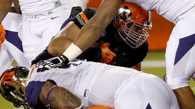 Castleman's Offense Helps Cowboys Tame Huskies In Cactus Bowl