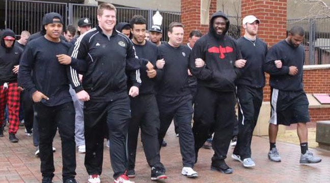 OU Players Lock Arms In Unity During Scheduled Spring Practice