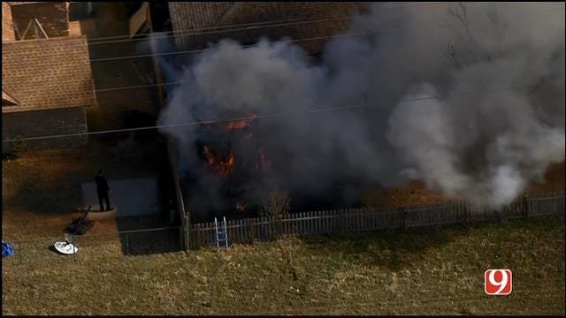 Grass Fire Catches Edmond Home On Fire